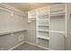 Walk-in closet with shelving and hanging rods, providing ample storage space at 6465 Robinsrock Dr, Indianapolis, IN 46268