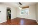 Inviting dining room featuring modern lighting, hardwood floors, and a view into the kitchen at 6465 Robinsrock Dr, Indianapolis, IN 46268