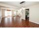 Open-concept living area with hardwood floors, a staircase, and a view of the kitchen at 6465 Robinsrock Dr, Indianapolis, IN 46268