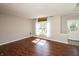Bright and spacious living room with hardwood floors and a large window with natural light at 6465 Robinsrock Dr, Indianapolis, IN 46268