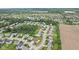 Aerial view of the neighborhood showcasing its community layout, green spaces, and residential homes at 7350 Gold King Way, Indianapolis, IN 46259