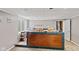 A bar area includes a wood bar with countertop, sink, and space for food preparation at 7350 Gold King Way, Indianapolis, IN 46259