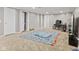 A carpeted basement with neutral walls offers flexible space for recreation and living at 7350 Gold King Way, Indianapolis, IN 46259