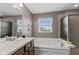 Bathroom featuring soaking tub and walk-in shower at 7350 Gold King Way, Indianapolis, IN 46259