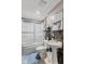 This bathroom offers a shower-tub and pedestal sink, offering essential convenience at 7350 Gold King Way, Indianapolis, IN 46259