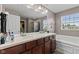 Spacious bathroom with double sink vanity and soaking tub at 7350 Gold King Way, Indianapolis, IN 46259