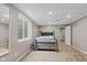 Bedroom showcases natural light, carpet flooring, and a cozy bed creating a relaxing space at 7350 Gold King Way, Indianapolis, IN 46259