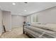 Bedroom features a cozy bed and window providing natural light, ideal for a restful retreat at 7350 Gold King Way, Indianapolis, IN 46259