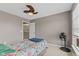 Bedroom featuring closet, natural light, and fan at 7350 Gold King Way, Indianapolis, IN 46259
