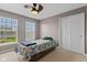Bedroom featuring closet, natural light, and fan at 7350 Gold King Way, Indianapolis, IN 46259
