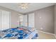 A light-filled bedroom with closet access, offering functionality and comfort at 7350 Gold King Way, Indianapolis, IN 46259