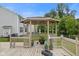 Enclosed gazebo and spacious deck, perfect for gatherings and relaxation in your private backyard at 7350 Gold King Way, Indianapolis, IN 46259