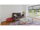 Cozy living room features a comfortable couch, a stylish rug, hardwood floors and natural light at 7350 Gold King Way, Indianapolis, IN 46259