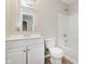 Standard bathroom featuring a white vanity with a large mirror, toilet, and a shower-tub combination at 7572 Wymm Ln, Ingalls, IN 46048