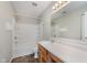 Bathroom features white tile, shower and vanity with white counters at 7572 Wymm Ln, Ingalls, IN 46048