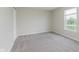 Bedroom features neutral carpet, one window and closet at 7572 Wymm Ln, Ingalls, IN 46048