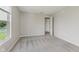 Bedroom with neutral carpet, one window and door to closet at 7572 Wymm Ln, Ingalls, IN 46048