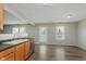Dining room area features wood floors and large windows with backyard views at 7572 Wymm Ln, Ingalls, IN 46048