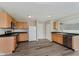 Open kitchen with oak cabinets, offering ample storage and modern convenience at 7572 Wymm Ln, Ingalls, IN 46048