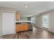 Eat-in kitchen features stainless steel appliances, wood cabinets and door to backyard at 7572 Wymm Ln, Ingalls, IN 46048