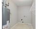 Utility room with hot water heater, electrical connections, and shelving at 7572 Wymm Ln, Ingalls, IN 46048