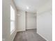 Walk-in closet with neutral carpet, large window and white wire shelving at 7572 Wymm Ln, Ingalls, IN 46048