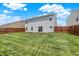 Spacious backyard with a well-kept lawn and privacy fence, ideal for outdoor activities at 7865 Danube St, Indianapolis, IN 46239