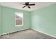 Well-lit bedroom with a ceiling fan and window at 7865 Danube St, Indianapolis, IN 46239