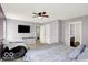 Comfortable bedroom with a ceiling fan, flat screen TV, and access to an en-suite bathroom at 7865 Danube St, Indianapolis, IN 46239