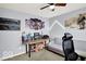 Unique bedroom featuring gaming decor, a comfortable sofa, and ample space for entertainment at 7865 Danube St, Indianapolis, IN 46239