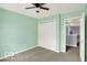 Neutral-toned bedroom features a closet, a ceiling fan and a hallway entrance at 7865 Danube St, Indianapolis, IN 46239