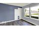 Bedroom with 3D wall art and large windows overlooking the neighborhood at 7865 Danube St, Indianapolis, IN 46239