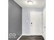 Inviting entryway with a secure smart lock and light grey walls at 7865 Danube St, Indianapolis, IN 46239