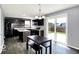 Eat-in kitchen features dark cabinetry, granite countertops, and stainless steel appliances at 7865 Danube St, Indianapolis, IN 46239