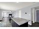 Eat-in kitchen island view, adjacent to living room at 7865 Danube St, Indianapolis, IN 46239