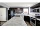 Spacious kitchen features an island, stainless steel appliances, and ample counter space at 7865 Danube St, Indianapolis, IN 46239