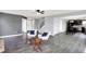 Open concept living space with modern floors, neutral paint, and seamless flow to kitchen at 7865 Danube St, Indianapolis, IN 46239