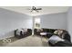 Cozy living room with comfortable furniture and a ceiling fan at 7865 Danube St, Indianapolis, IN 46239