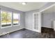 Office with large windows and French doors leading to another room at 7865 Danube St, Indianapolis, IN 46239