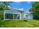 Backyard featuring a shed, a covered patio with dining set, grill and a fire pit at 8047 Red Barn Cir, Indianapolis, IN 46239