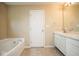 Bathroom features a tub and double sink at 8047 Red Barn Cir, Indianapolis, IN 46239