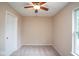 This bedroom features carpet floors, natural light, and a ceiling fan at 8047 Red Barn Cir, Indianapolis, IN 46239