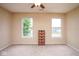 Bright, airy bedroom with neutral walls, carpet flooring, and natural lighting at 8047 Red Barn Cir, Indianapolis, IN 46239