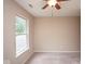 Carpeted bedroom featuring a window offering natural light and neutral walls at 8047 Red Barn Cir, Indianapolis, IN 46239