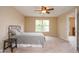 Neutral bedroom featuring carpet flooring, a bed and natural light at 8047 Red Barn Cir, Indianapolis, IN 46239