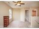 Neutral bedroom featuring carpet flooring, a ceiling fan and natural light at 8047 Red Barn Cir, Indianapolis, IN 46239