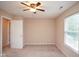 This bedroom features carpet floors, natural light, and a ceiling fan at 8047 Red Barn Cir, Indianapolis, IN 46239