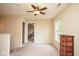 Spacious bedroom featuring carpet flooring, a ceiling fan and natural light at 8047 Red Barn Cir, Indianapolis, IN 46239