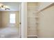 An open closet features adjustable white metal shelving at 8047 Red Barn Cir, Indianapolis, IN 46239