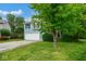 Two-story home with an attached garage and lush green lawn at 8047 Red Barn Cir, Indianapolis, IN 46239